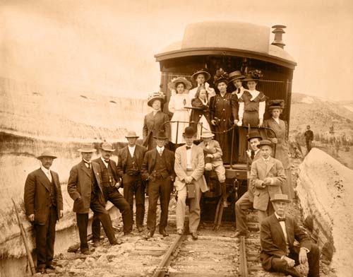 People Posed in front of Train