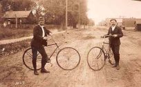 Two Men on Bikes on West Pearl Street