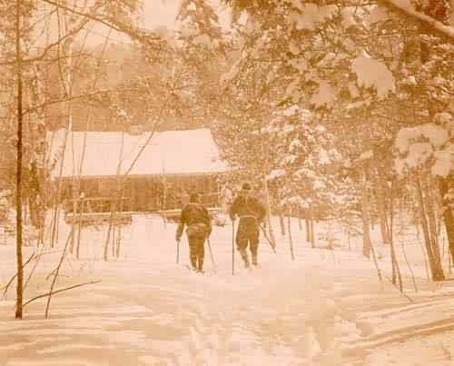 Cross Country Skiers Heading Towards a Cabin