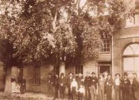 People in Front of a Pearl St. Building