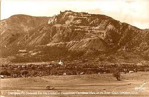 Cheyenne Mt. showing zig-zag course of Broadmoor - Cheyenne Highway up its side