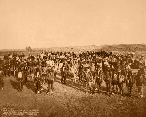 At the Dance. Part of the 8th U.S. Cavalry and 3rd Infantry at the great Indian Grass Dance on Reservation